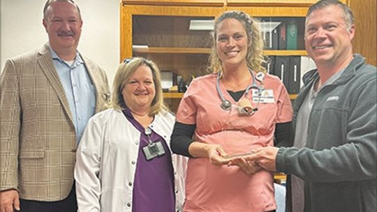 Camie Kuhn receives award