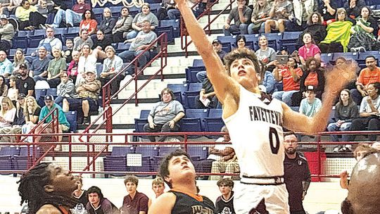 Fayetteville boy's hoops hangs on in OT vs Wells
