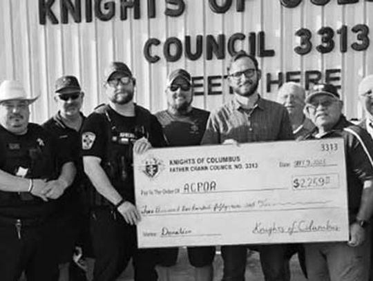 Austin County Police Officers Association receives donation from Sealy KC's