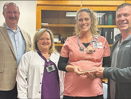 Camie Kuhn receives award