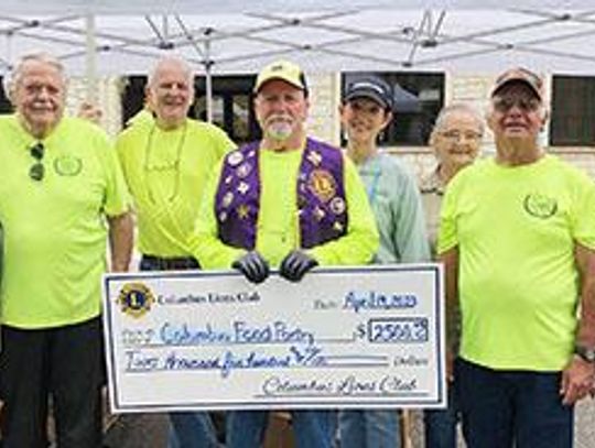 Columbus Lions presents check to Food Pantry