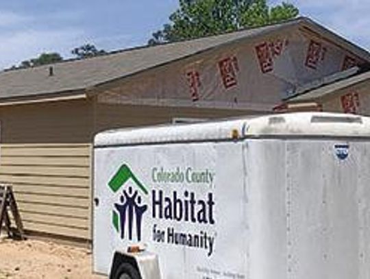 Drymalla Construction adds cap to habitat home roof