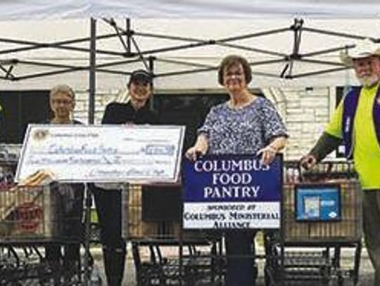 Lions donate to Columbus Food Pantry