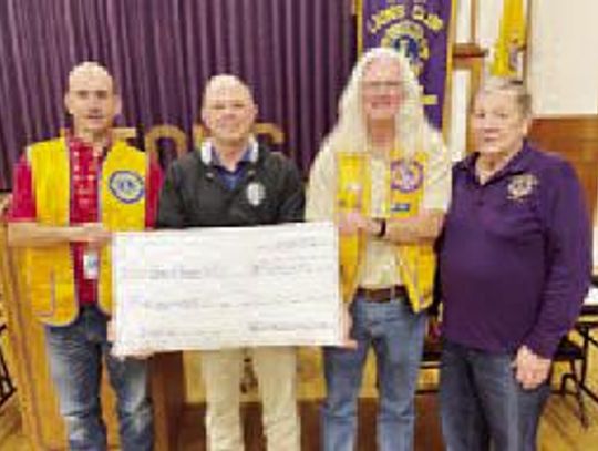 Lions donate to Guns and Hoses