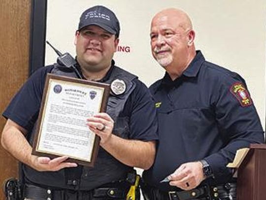 Officer Keith Llanes receives Lifesaving Award