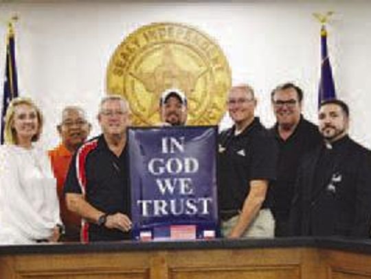 Sealy Knights of Columbus present Sealy ISD with God We Trust posters