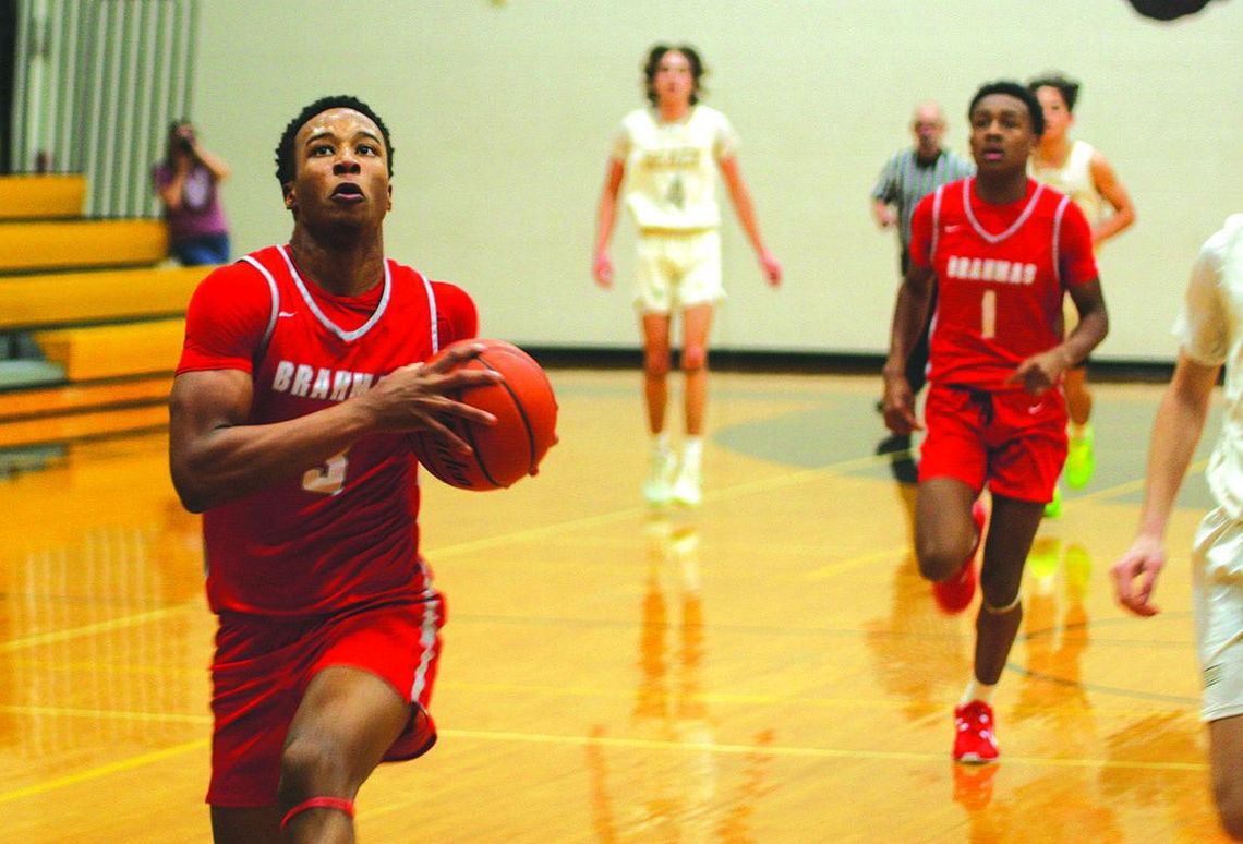 Bellville boy’s hoops holds off Sealy in OT thriller