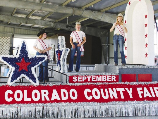 2023 Colorado County Fair’s Junior Queen Mylee Moffett, left, Membership Queen Ashley Treece, center, and Queen Taylr Tipton get accustomed to their new float on July 2 at the Colorado County Fairgrounds in Columbus. Photo by John Jones, Banner Press